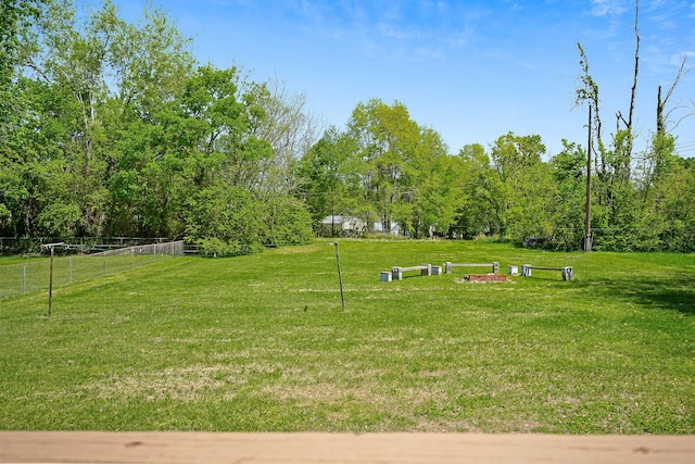 view of home's community with a lawn