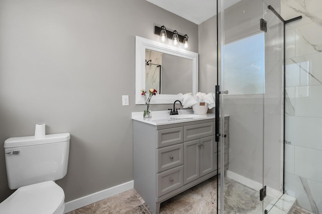 bathroom with a shower with shower door, vanity, and toilet