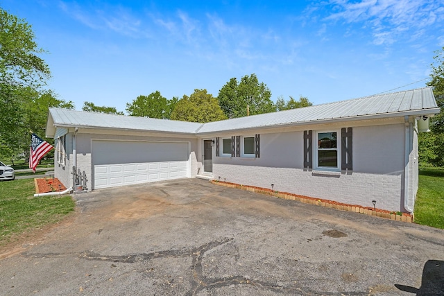 ranch-style home with a garage