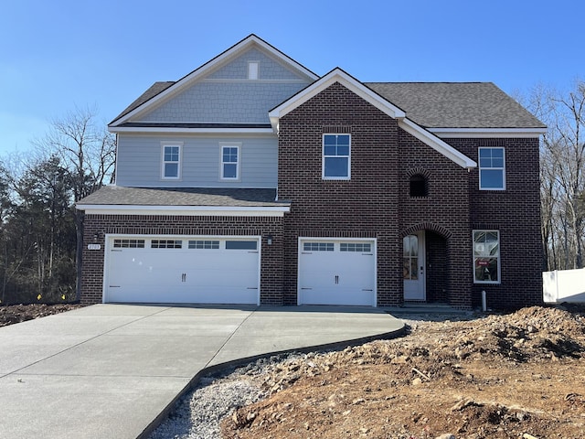 view of front of property with a garage