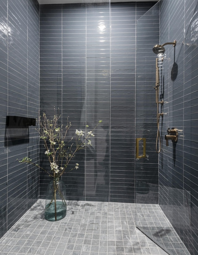 bathroom with tiled shower