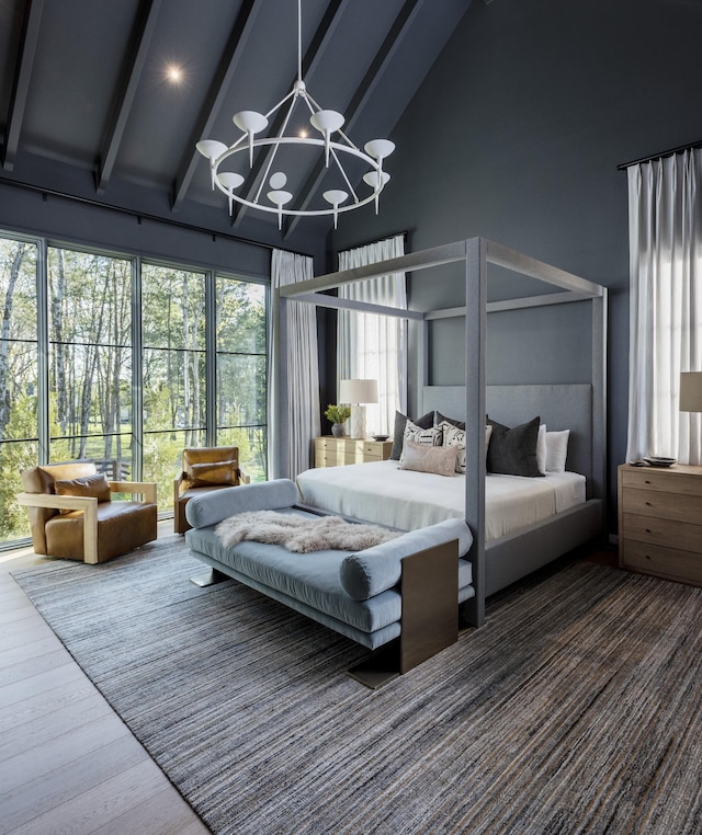 bedroom with high vaulted ceiling, hardwood / wood-style floors, beam ceiling, and a chandelier