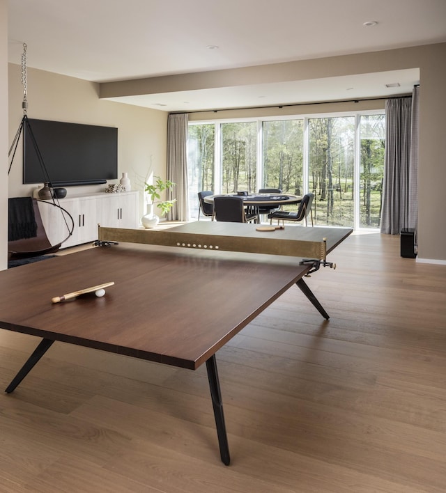 recreation room featuring light wood-type flooring