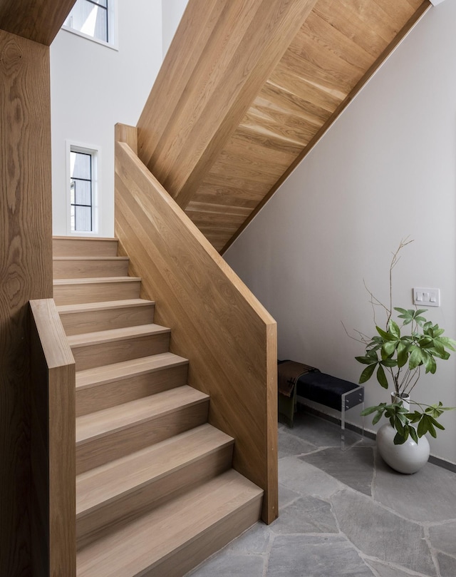 stairway featuring wood ceiling