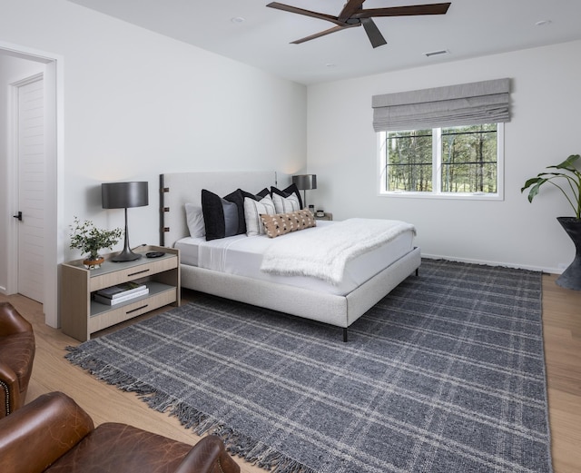 bedroom featuring ceiling fan and dark hardwood / wood-style floors