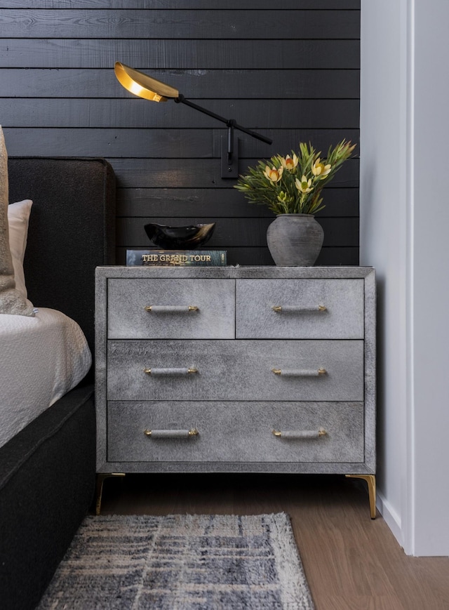 interior space featuring dark wood-type flooring and wood walls