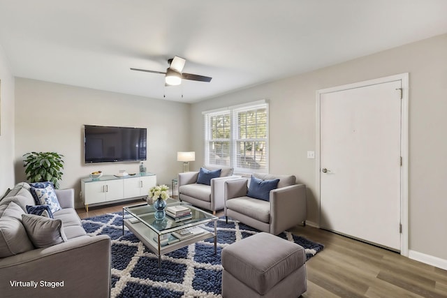 living room featuring ceiling fan and wood-type flooring