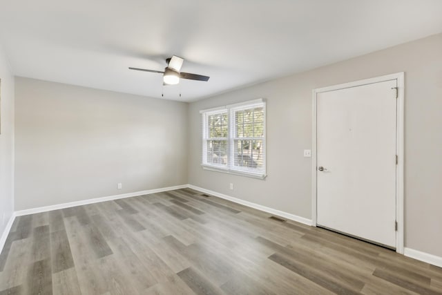 unfurnished room featuring ceiling fan and light hardwood / wood-style flooring