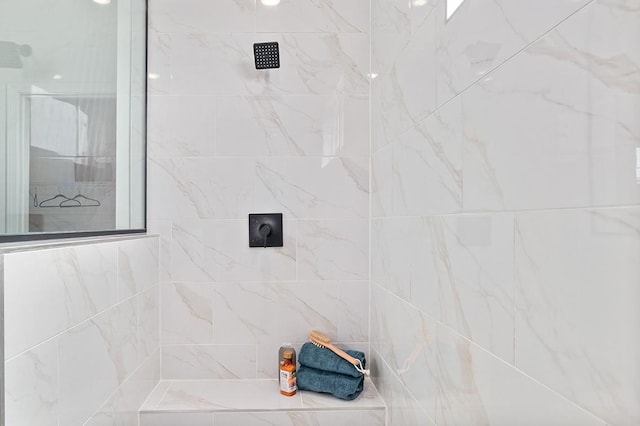 bathroom with tiled shower