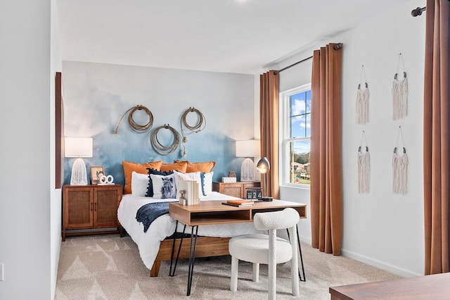 bedroom featuring multiple windows and light carpet