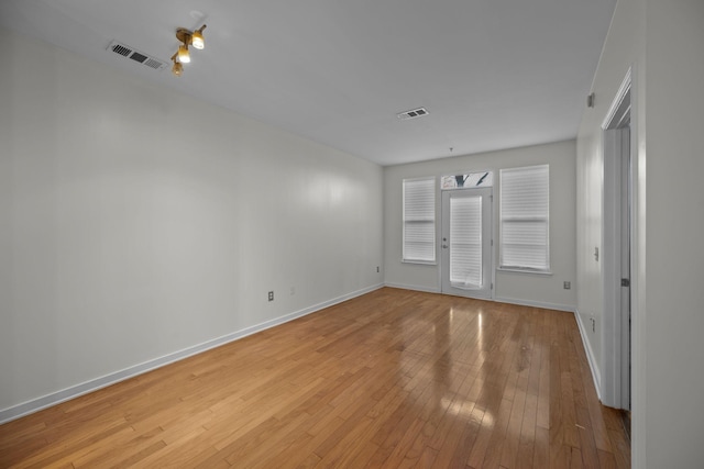 unfurnished room featuring light hardwood / wood-style flooring