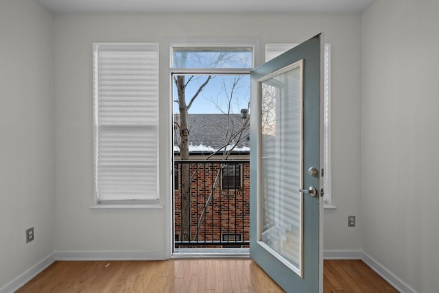 entryway featuring french doors and light wood-type flooring