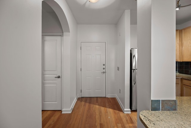 hall featuring light wood-type flooring