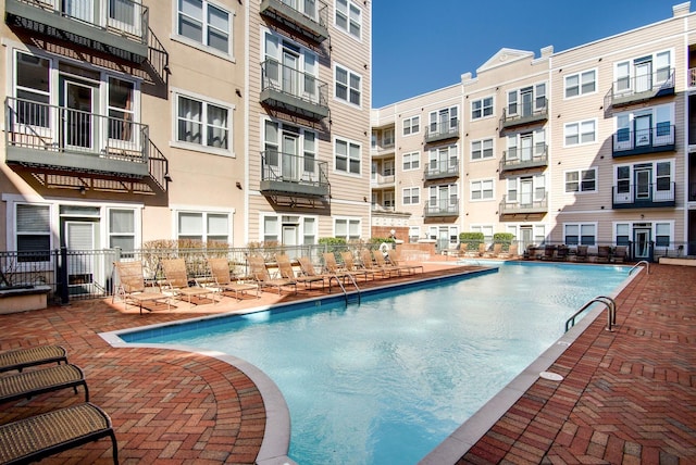 view of swimming pool with a patio area