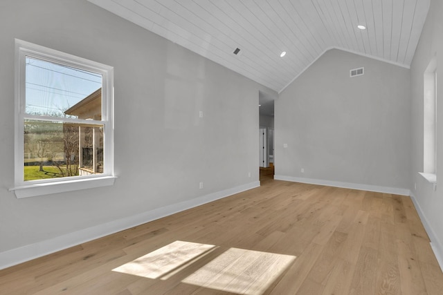 spare room with baseboards, visible vents, lofted ceiling, wood ceiling, and wood finished floors