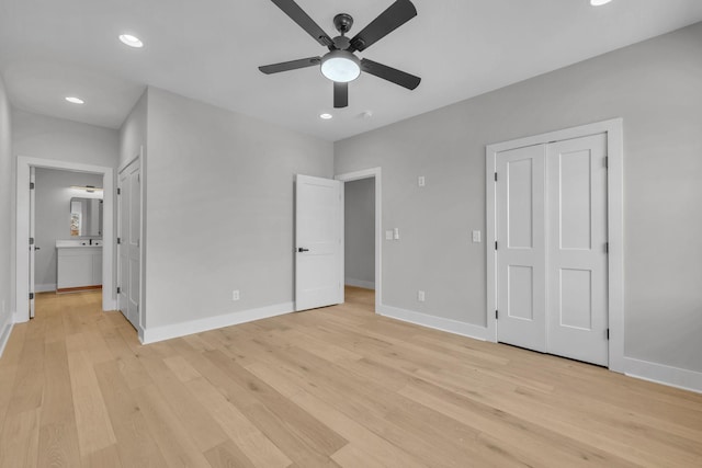 unfurnished bedroom with light wood finished floors, baseboards, and recessed lighting