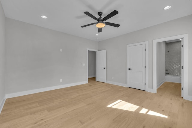 unfurnished bedroom with recessed lighting, light wood-style floors, a ceiling fan, ensuite bath, and baseboards