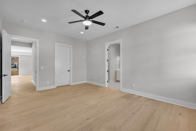 unfurnished bedroom featuring ceiling fan, connected bathroom, light wood-style flooring, recessed lighting, and baseboards