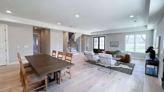 dining room with recessed lighting, visible vents, baseboards, stairway, and light wood finished floors