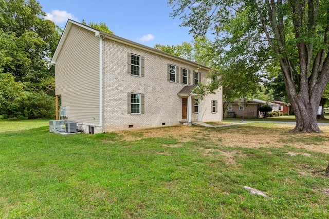 rear view of property featuring a yard