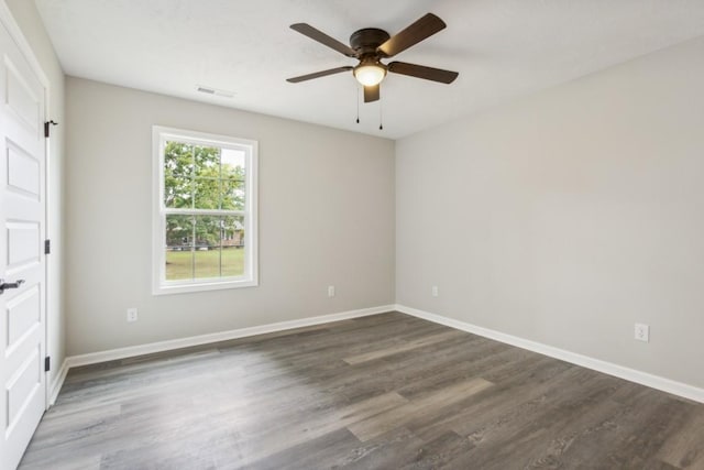 unfurnished room with ceiling fan and dark hardwood / wood-style floors