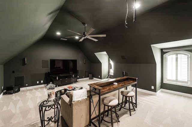 interior space featuring lofted ceiling and ceiling fan