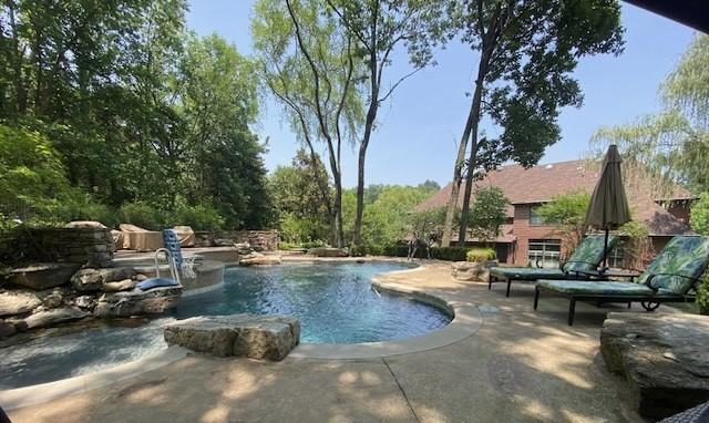 view of pool featuring a patio area