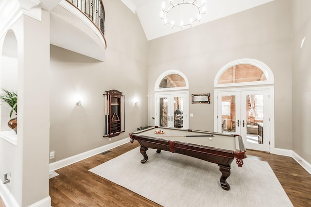 playroom with high vaulted ceiling, billiards, dark hardwood / wood-style flooring, and french doors