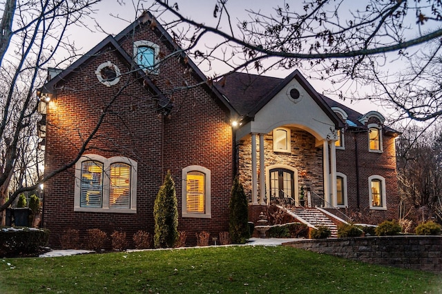 view of front of home with a yard