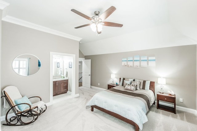 bedroom with crown molding, ensuite bathroom, vaulted ceiling, and light carpet