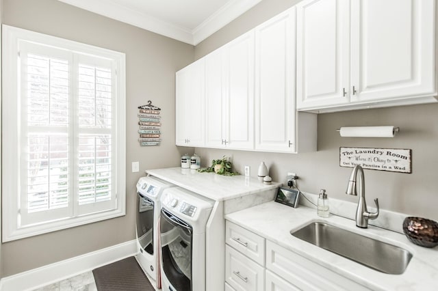 laundry room with cabinets, crown molding, sink, and independent washer and dryer