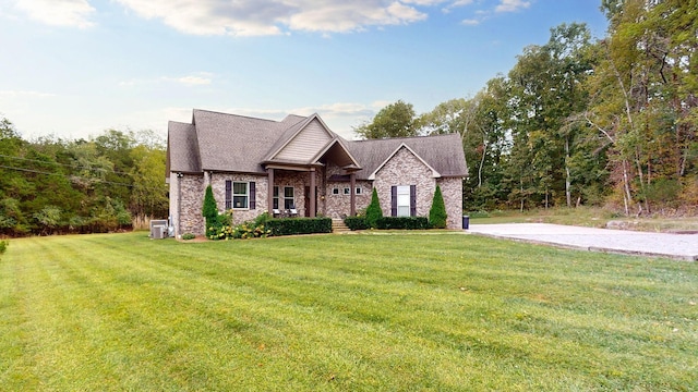 view of front of home with covered porch and a front yard