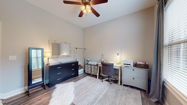 office area with vaulted ceiling, dark wood-type flooring, and ceiling fan