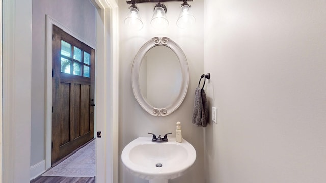 bathroom featuring sink and hardwood / wood-style floors