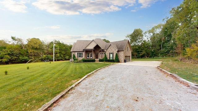 view of front of property with a front lawn and a garage