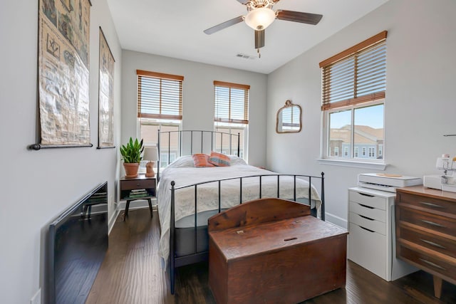 bedroom featuring ceiling fan and dark hardwood / wood-style floors