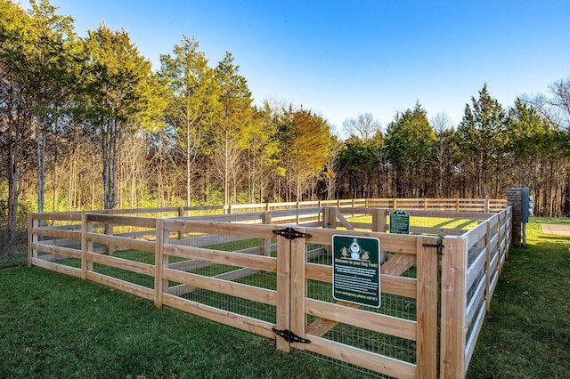 view of gate featuring a yard