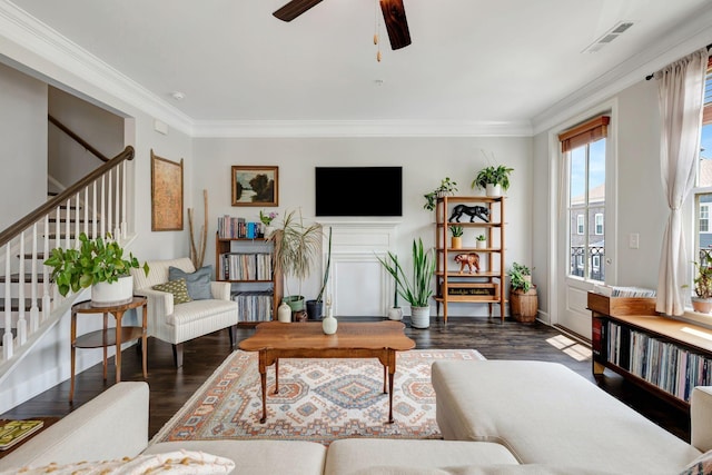 living room with ceiling fan, dark hardwood / wood-style flooring, and crown molding