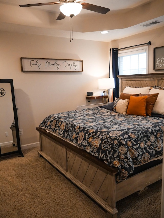 carpeted bedroom with ceiling fan