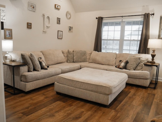 living room with lofted ceiling and dark wood-type flooring