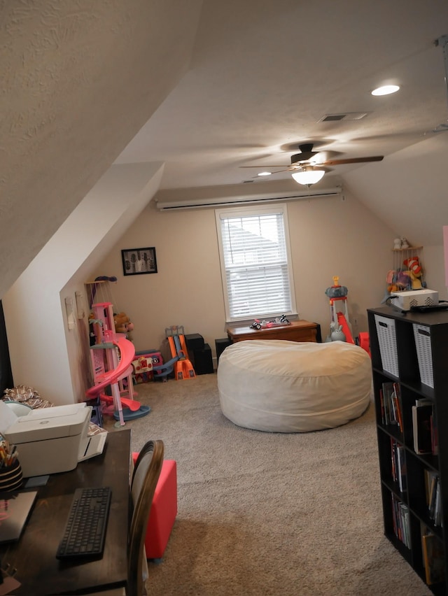 recreation room with ceiling fan, carpet flooring, and vaulted ceiling