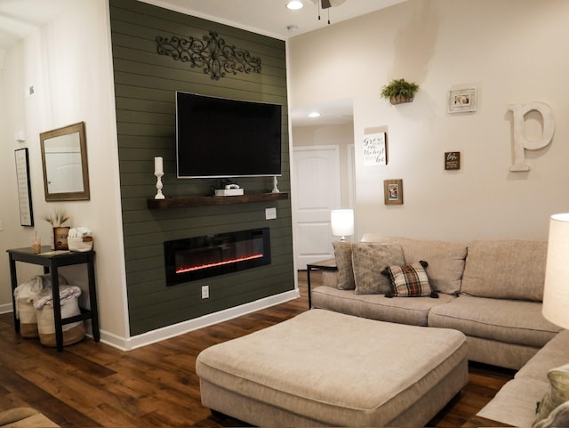 living room with ceiling fan, dark hardwood / wood-style flooring, and a fireplace