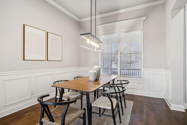 dining space featuring dark hardwood / wood-style flooring and crown molding