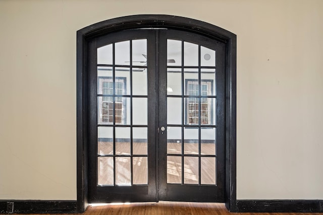 room details featuring french doors and hardwood / wood-style flooring