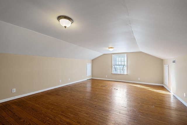 bonus room featuring lofted ceiling and hardwood / wood-style flooring