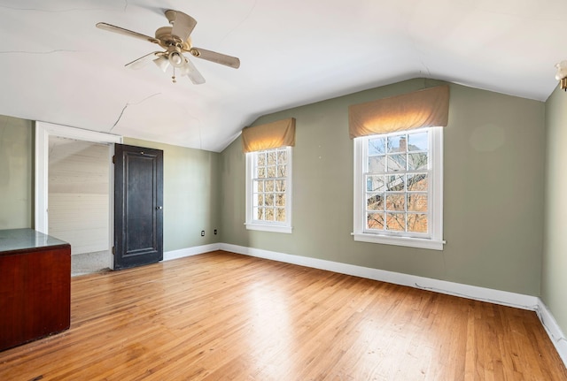 additional living space featuring lofted ceiling, ceiling fan, and light hardwood / wood-style flooring