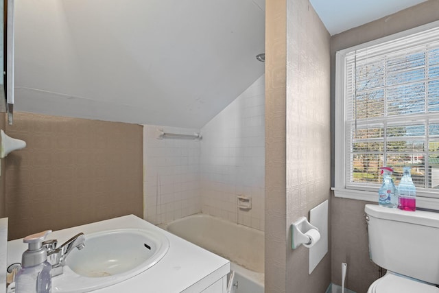 full bathroom featuring toilet, shower / tub combination, a healthy amount of sunlight, and sink