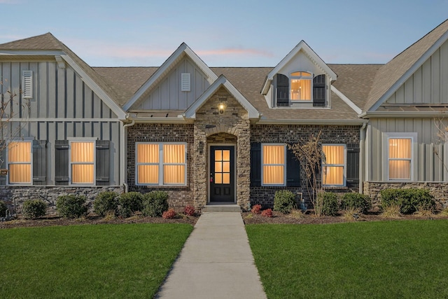 view of front of home with a lawn