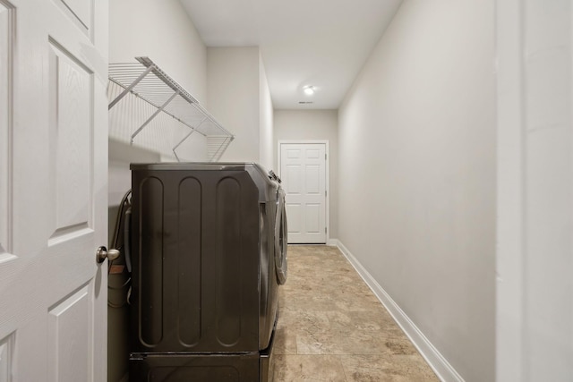 clothes washing area featuring independent washer and dryer