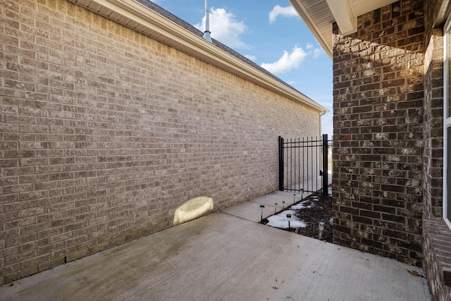 view of side of home with a patio